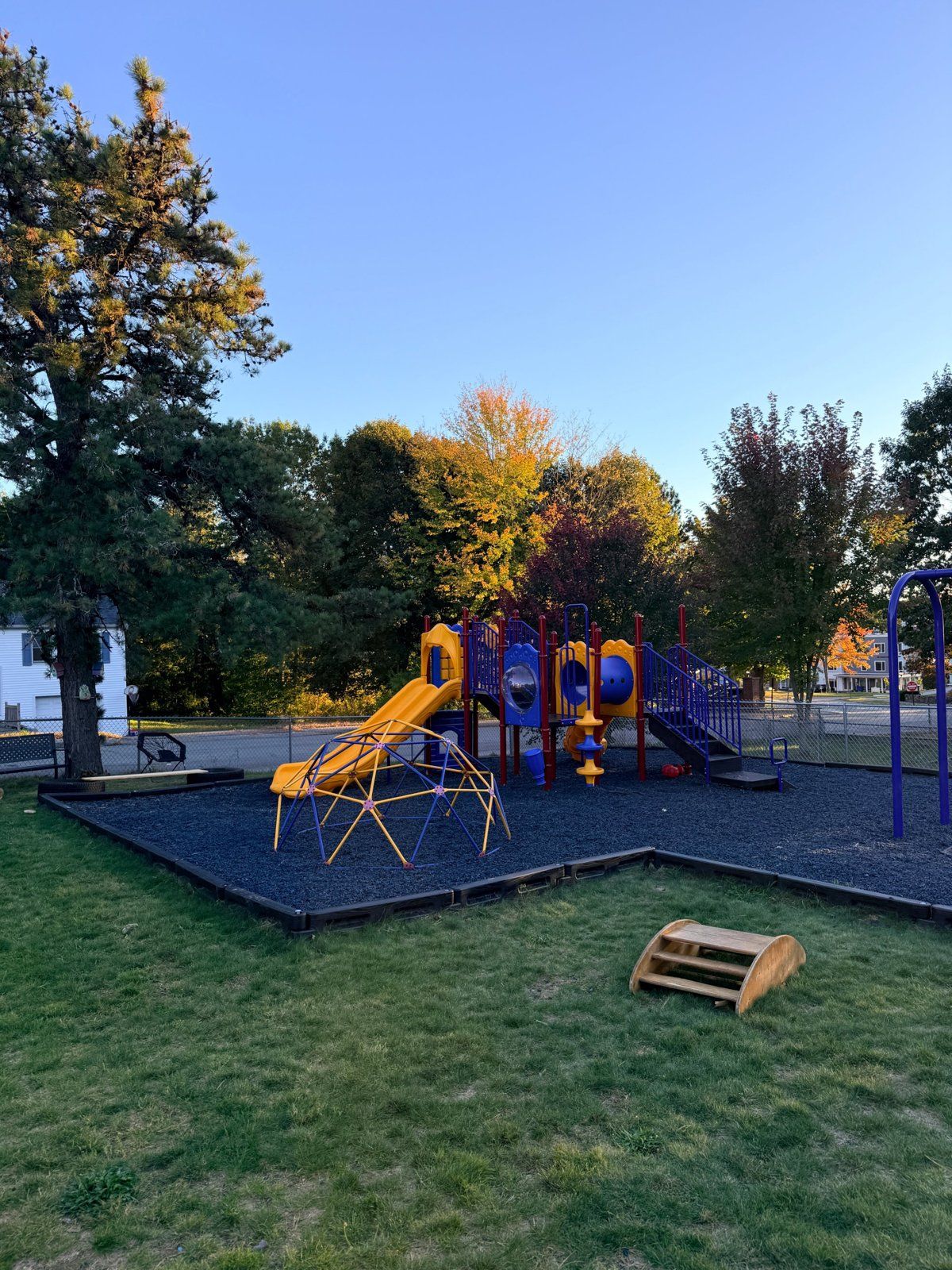 The Ready Set Grow playground and yard on a sunny fall day